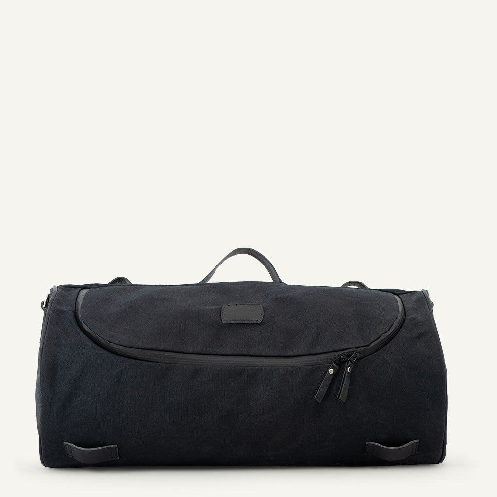 Black moto roller bag in black waxed-canvas.