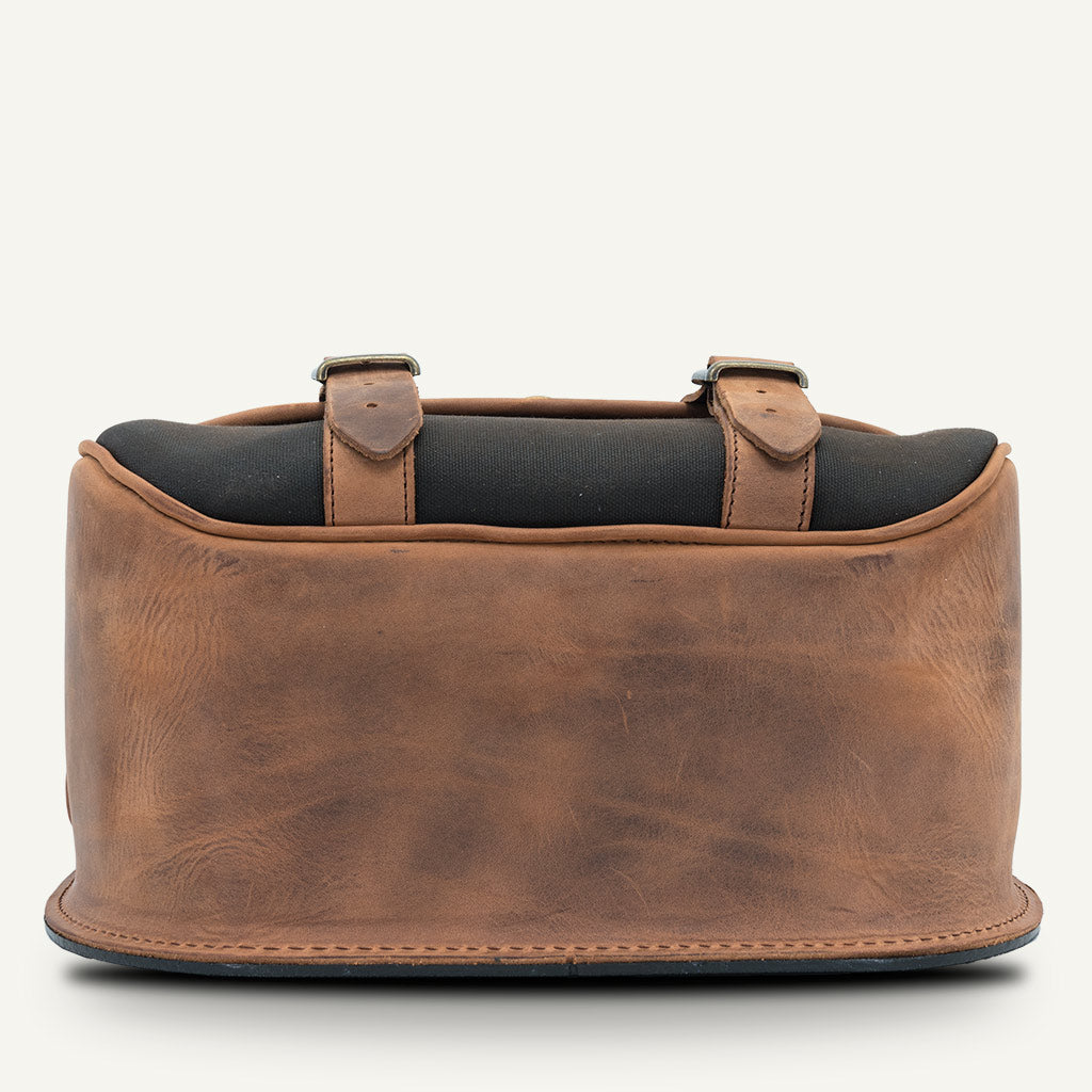 Hard leather pannier waxed cotton.