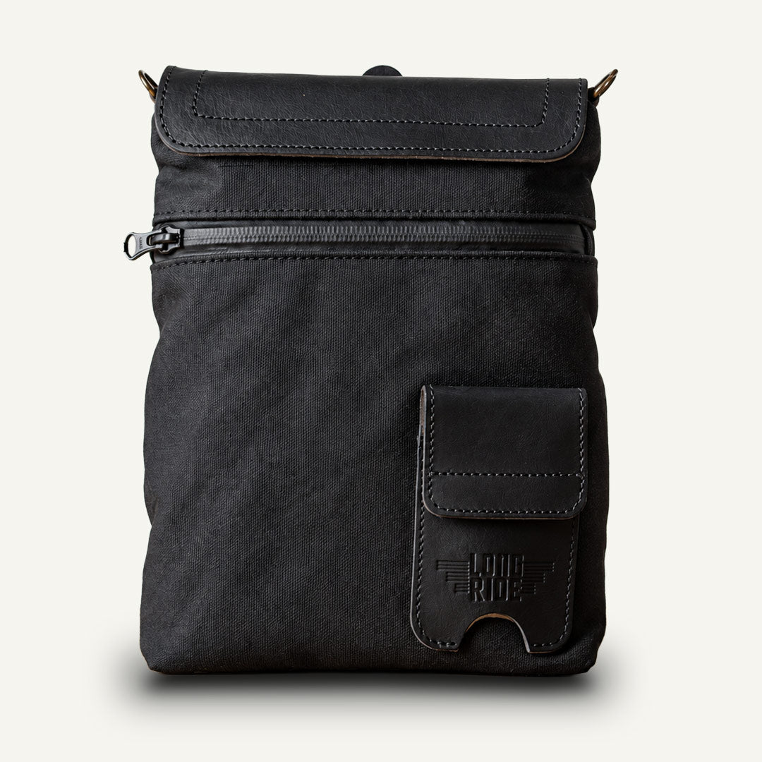Black magnetic tank bag for motorcycle.