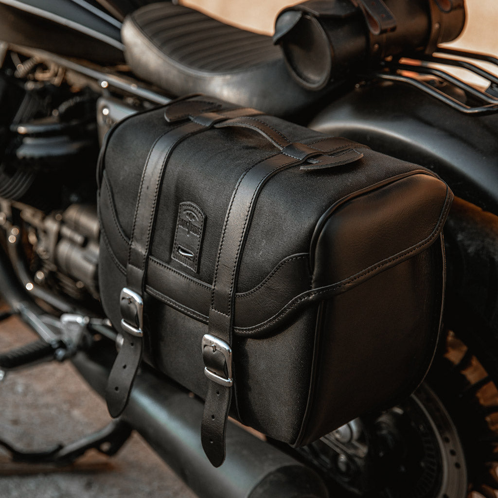 Cool black hard pannier for classic motorcycle.