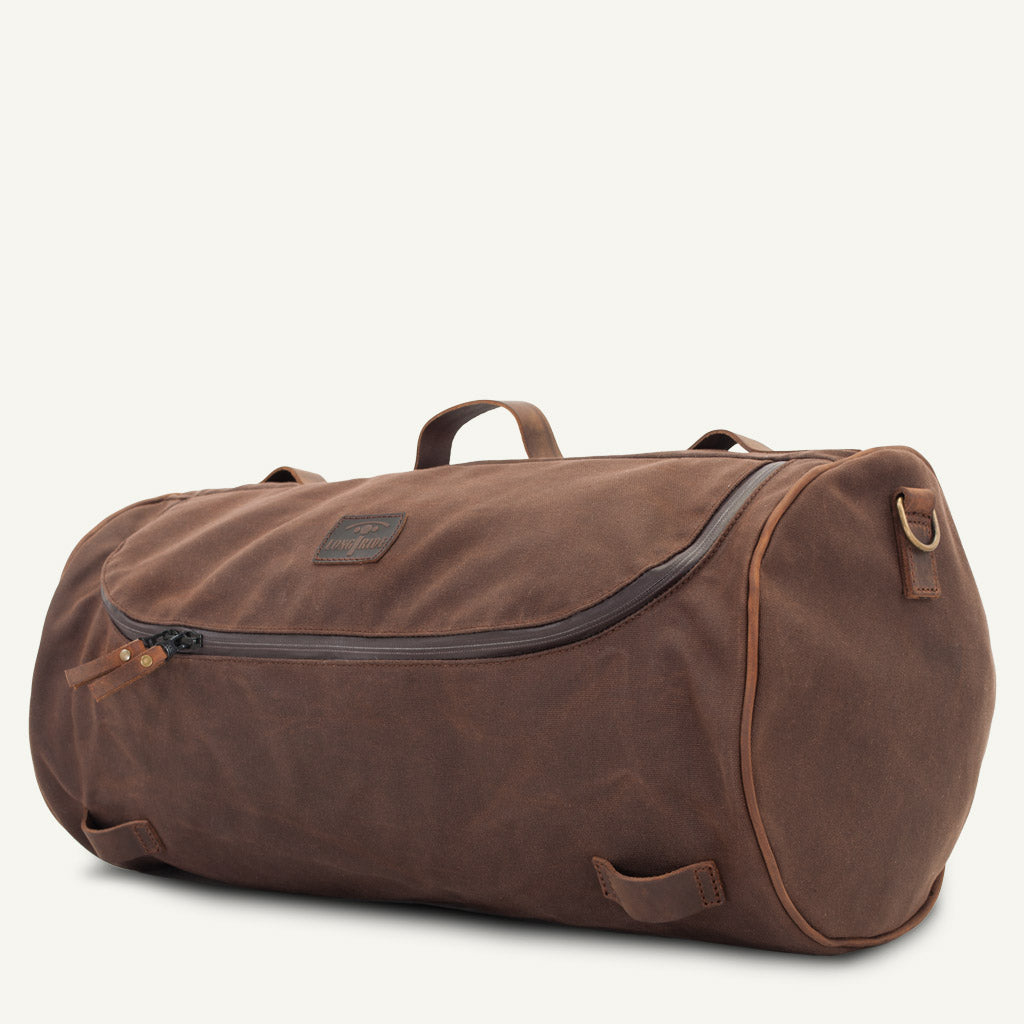 Waterproof waxed-cotton duffle bag for motorcycle.